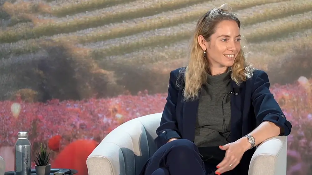 Romi Gubes being interviewed on stage at the Home Care Innovation Forum
