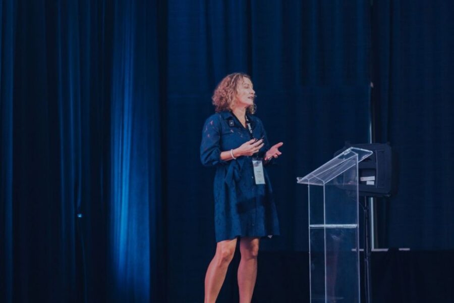 susan-kahlau on stage at a sensi event: readmission rates