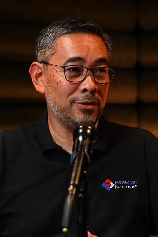 Juan Tuason speaking on a podcast