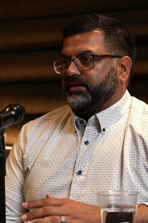 Kunu Kaushal speaking on a podcast