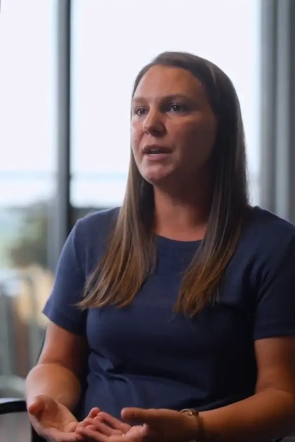 A woman seated within an independent living facility posed amid giving an interview response